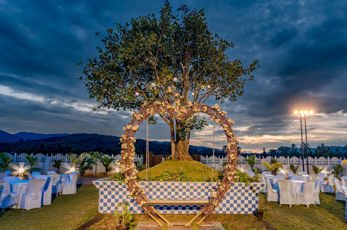 Festive evening lights above an outdoor event